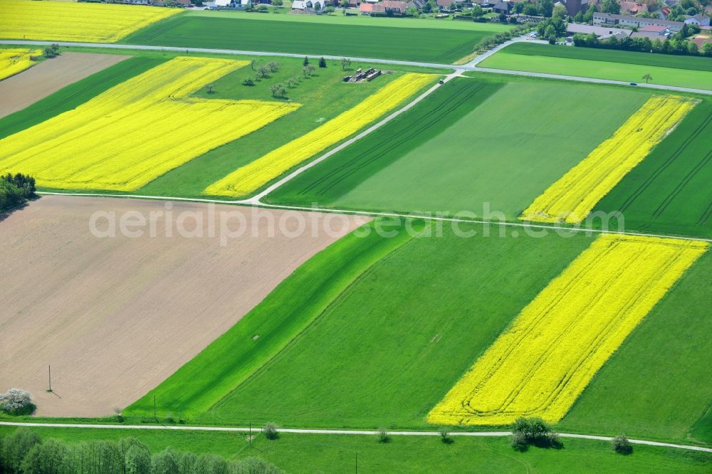 Karbach from the bird's eye view: Field landscape yellow flowering rapeseed flowers in Karbach in the state Bavaria