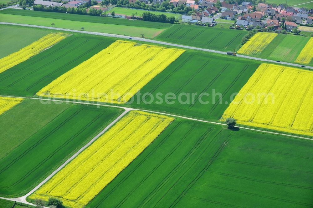 Aerial image Karbach - Field landscape yellow flowering rapeseed flowers in Karbach in the state Bavaria