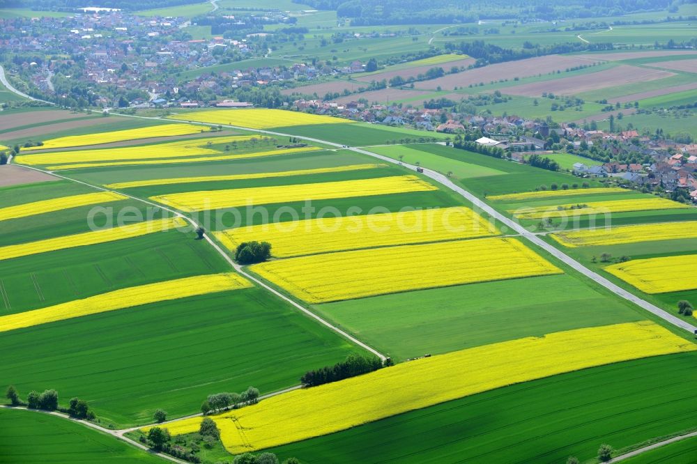 Aerial photograph Karbach - Field landscape yellow flowering rapeseed flowers in Karbach in the state Bavaria