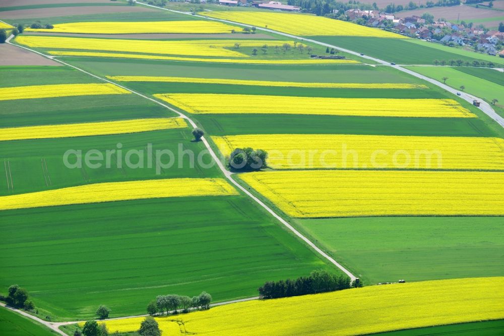 Karbach from above - Field landscape yellow flowering rapeseed flowers in Karbach in the state Bavaria