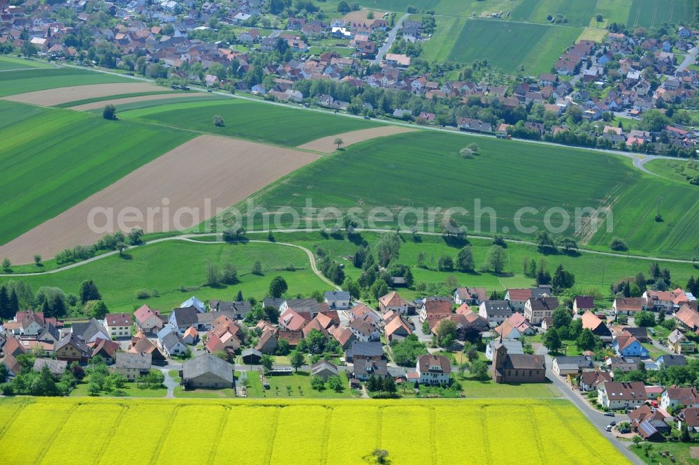 Aerial photograph Karbach - Field landscape yellow flowering rapeseed flowers in Karbach in the state Bavaria