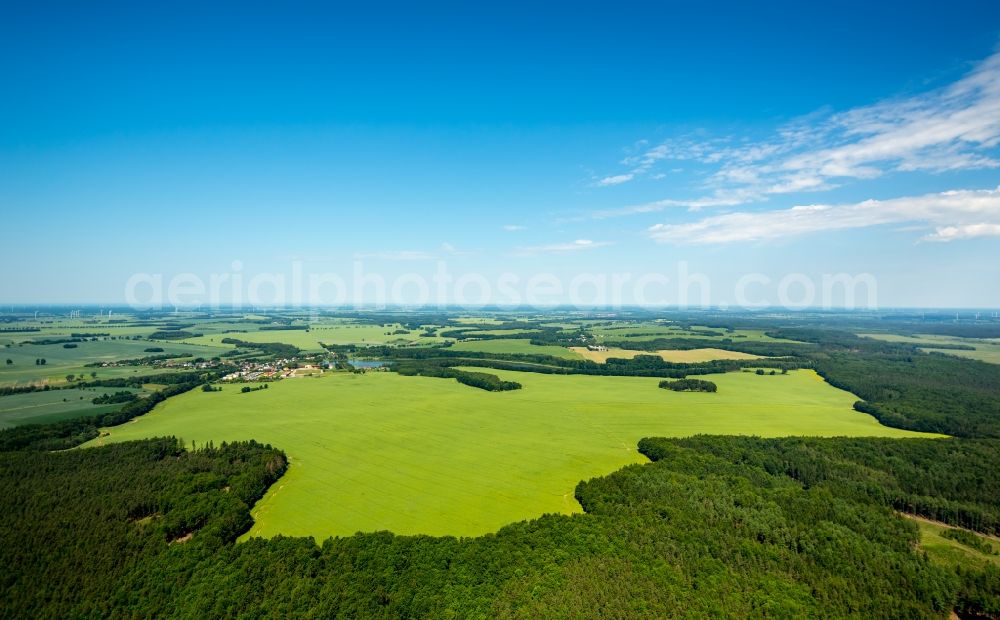 Aerial image Kartkowo - Field landscape yellow flowering rapeseed flowers in Kartkowo in Pomorskie, Poland