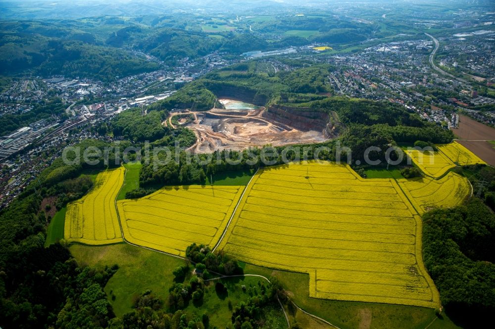 Iserlohn from above - Field landscape yellow flowering rapeseed flowers in Letmathe in Iserlohn in the state North Rhine-Westphalia