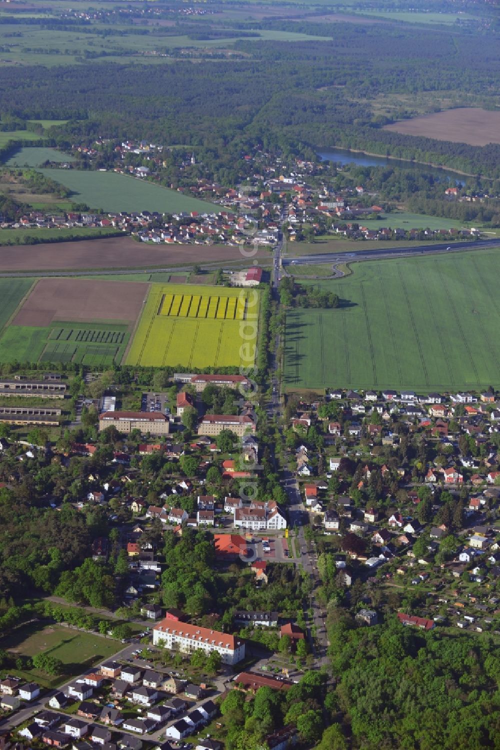 Aerial photograph Stahnsdorf - Field landscape yellow flowering rapeseed flowers in Stahnsdorf in the state Brandenburg