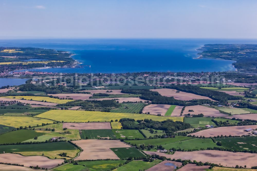 Osterby from above - Agricultural fields with adjacent forest and forest areas in Osterby in the state Schleswig-Holstein, Germany