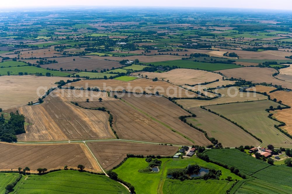 Aerial photograph Pommerby - Agricultural fields with adjacent forest and forest areas at Boysenfeld - Wattsfeld in Pommerby in the state Schleswig-Holstein, Germany