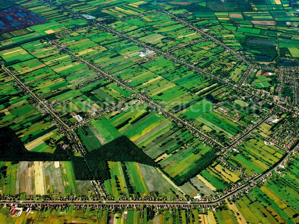 Papenburg from above - Fields and fen culture in Papenburg in the state of Lower Saxony. Papenburg is Germany's oldest and longest fen colony. The landscape surrounding the town is still characterised by moor colonisation, the moors and canals taking their course through fields