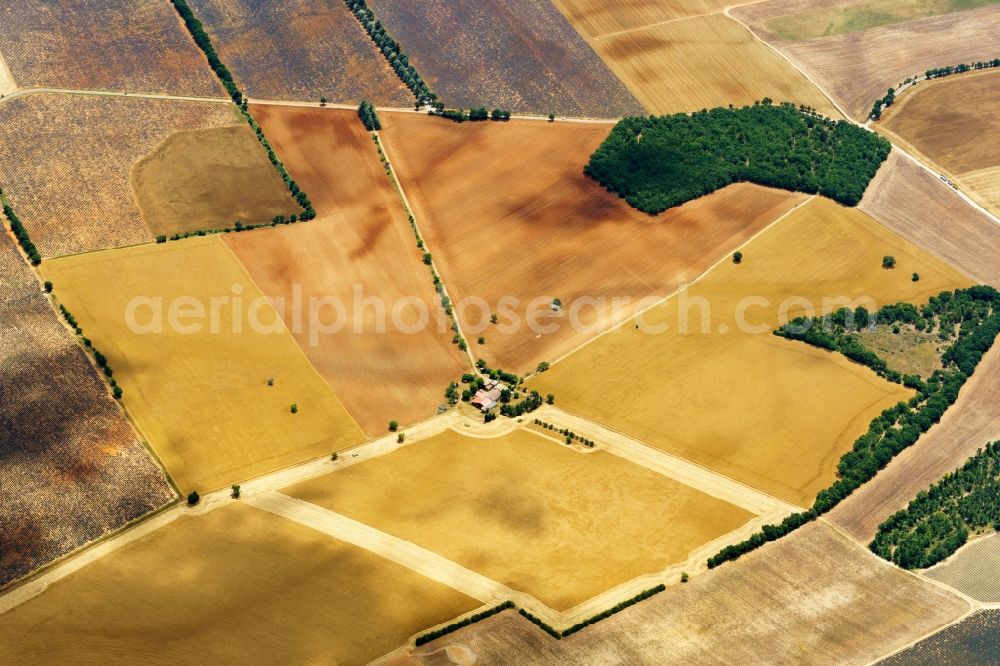 Aerial image Puimoisson - Farm house and fields of a sunflower plantage in Puimoisson in Provence-Alpes-Cote d'Azur, France