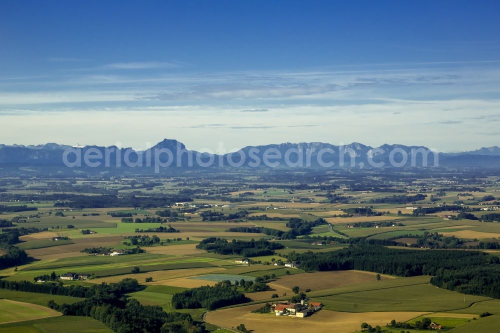 Aerial image Schleißheim - View of the fields and meadows of the Alpine Upland with scattered houses near Schleissheim in the state Upper Austria in Austria. In the background the silhouette of the Totes Gebirge is visible