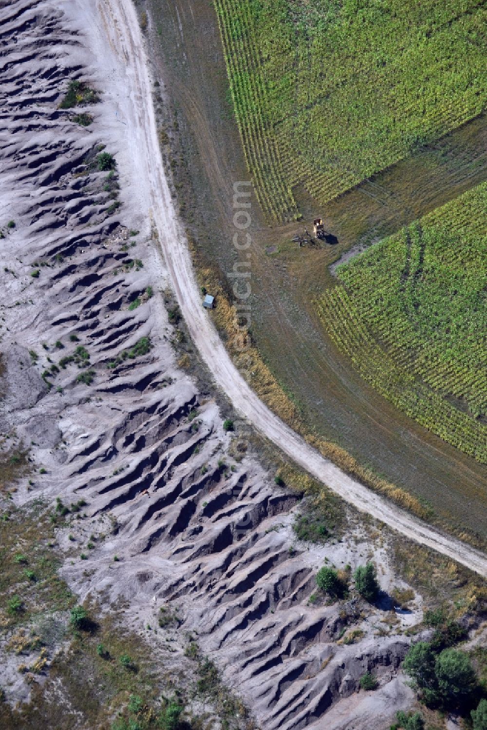 Aerial photograph Grünewalde - Field edge to the slag heap of brown coal mining - mining landscape near Gruenwalde in Brandenburg