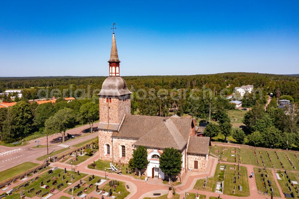 Jättböle from the bird's eye view: Church building Jomala kyrka a stone church in the village center in Jaettboele in Alands landsbygd, Aland