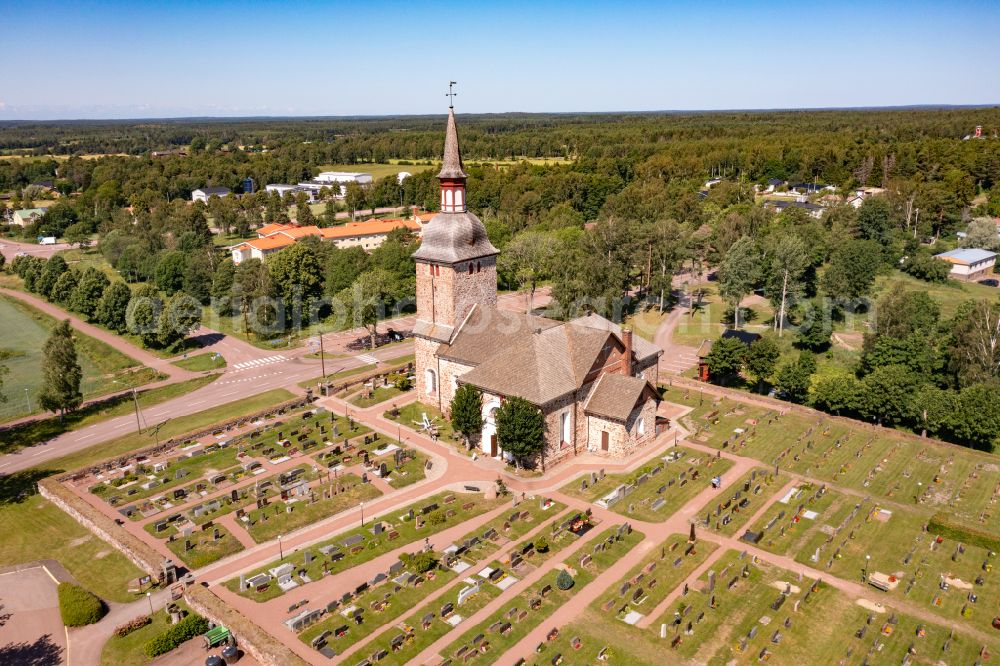 Aerial image Jättböle - Church building Jomala kyrka a stone church in the village center in Jaettboele in Alands landsbygd, Aland