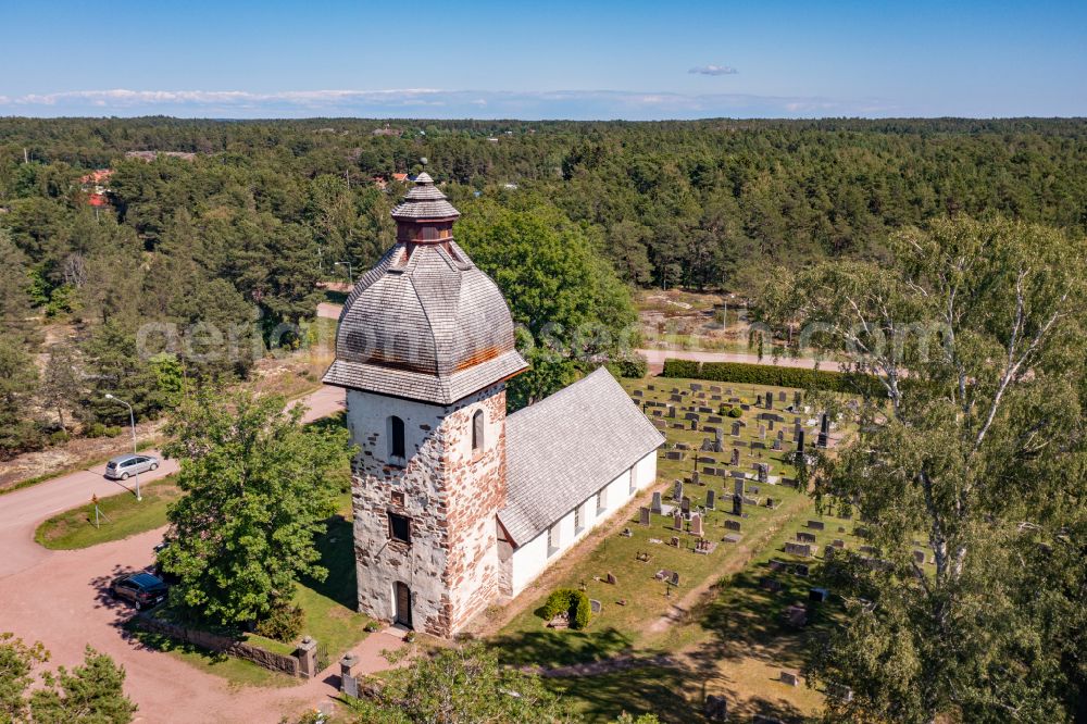 Aerial photograph Vardö - Church building Vaedoe kirka a stone church in the village center in Vardoe in Alands skaergard, Aland