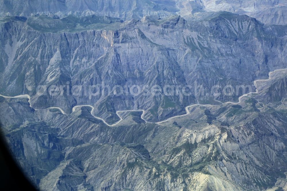 Aerial image Sagros Mountains - Looking fom an airliner onto the Rocky desert landscape in Zagros mountains at the river Koohrang in Khuzestan Province, Iran