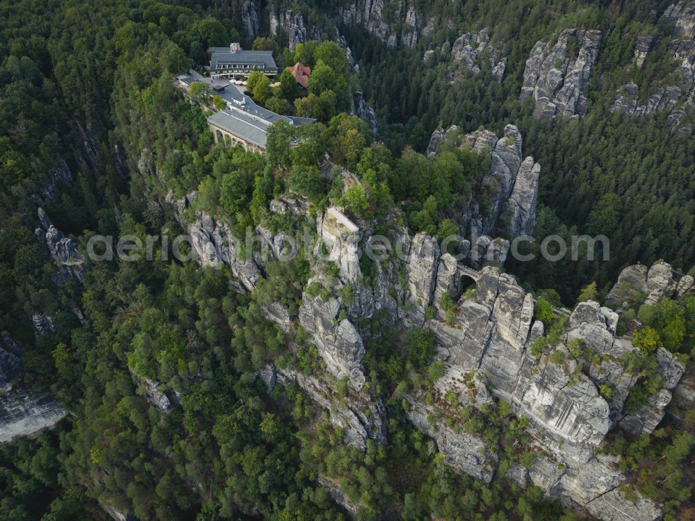 Aerial image Lohmen - Rock massif and mountain landscape with the Bastei viewpoint - platform on the Basteiweg road in Lohmen, Elbe Sandstone Mountains in the state of Saxony, Germany