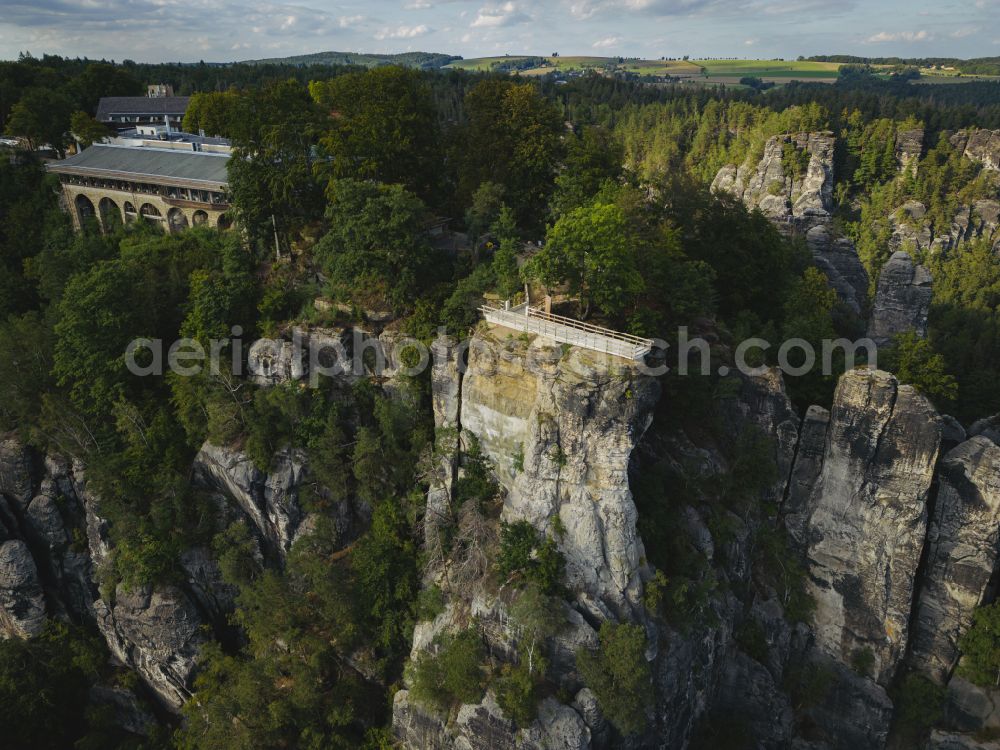 Aerial photograph Lohmen - Rock massif and mountain landscape with the Bastei viewpoint - platform on the Basteiweg road in Lohmen, Elbe Sandstone Mountains in the state of Saxony, Germany