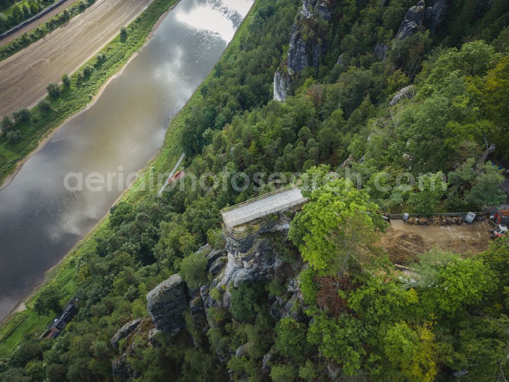 Aerial photograph Lohmen - Rock massif and mountain landscape with the Bastei viewpoint - platform on the Basteiweg road in Lohmen, Elbe Sandstone Mountains in the state of Saxony, Germany