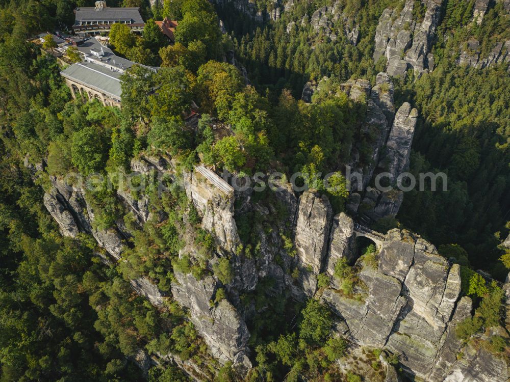 Lohmen from above - Rock massif and mountain landscape with the Bastei viewpoint - platform on the Basteiweg road in Lohmen, Elbe Sandstone Mountains in the state of Saxony, Germany