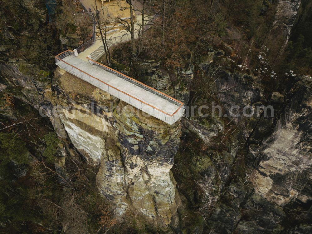 Aerial image Lohmen - Rock massif and mountain landscape with the Bastei viewpoint - platform on the Basteiweg road in Lohmen, Elbe Sandstone Mountains in the state of Saxony, Germany