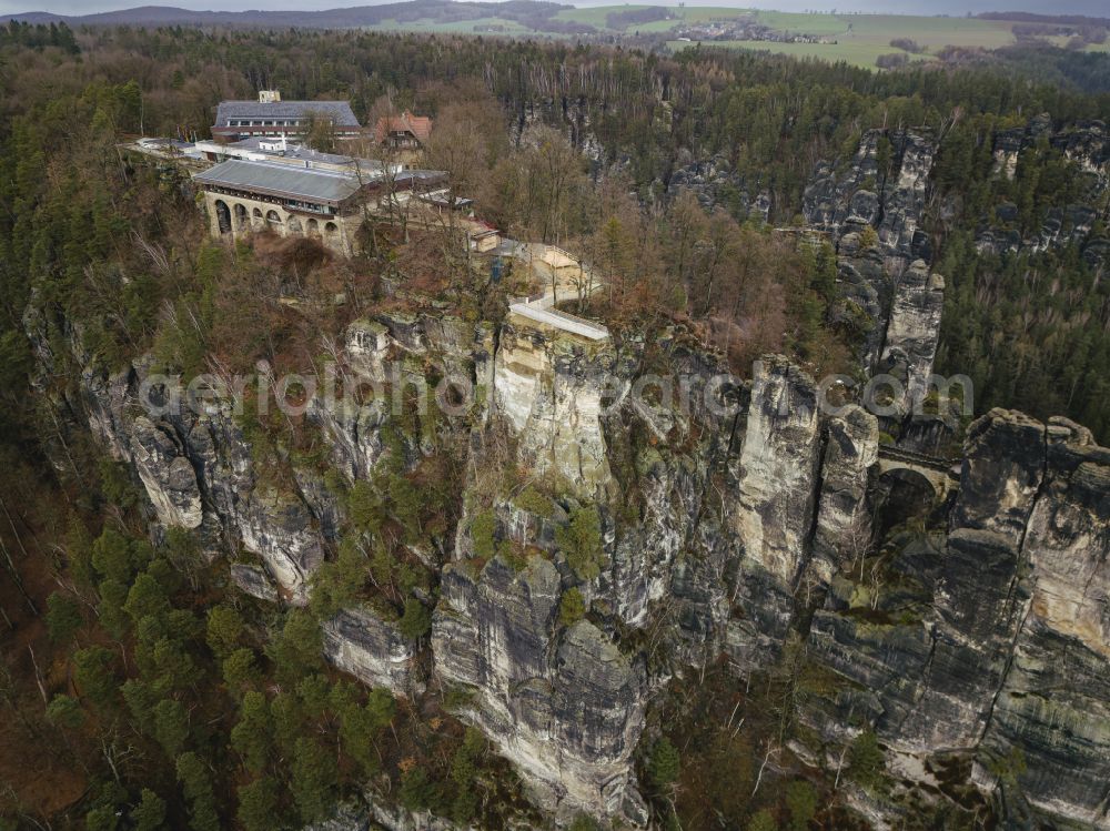 Aerial photograph Lohmen - Rock massif and mountain landscape with the Bastei viewpoint - platform on the Basteiweg road in Lohmen, Elbe Sandstone Mountains in the state of Saxony, Germany