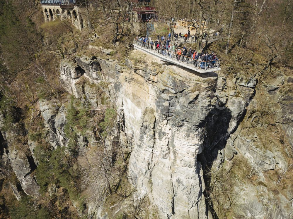 Lohmen from above - Rock massif and mountain landscape with the Bastei viewpoint - platform on the Basteiweg road in Lohmen, Elbe Sandstone Mountains in the state of Saxony, Germany