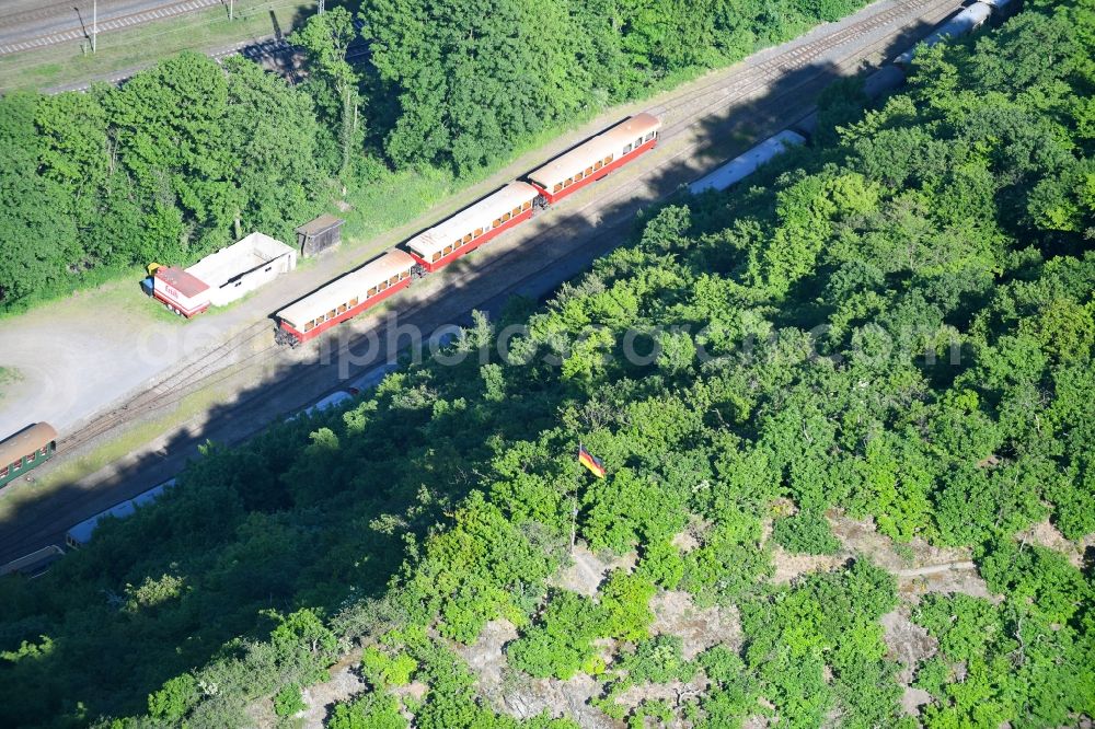 Brohl-Lützing from the bird's eye view: Rock and mountain landscape with Germany - flag in a forest area in Brohl-Lutzing in the state of Rhineland-Palatinate, Germany