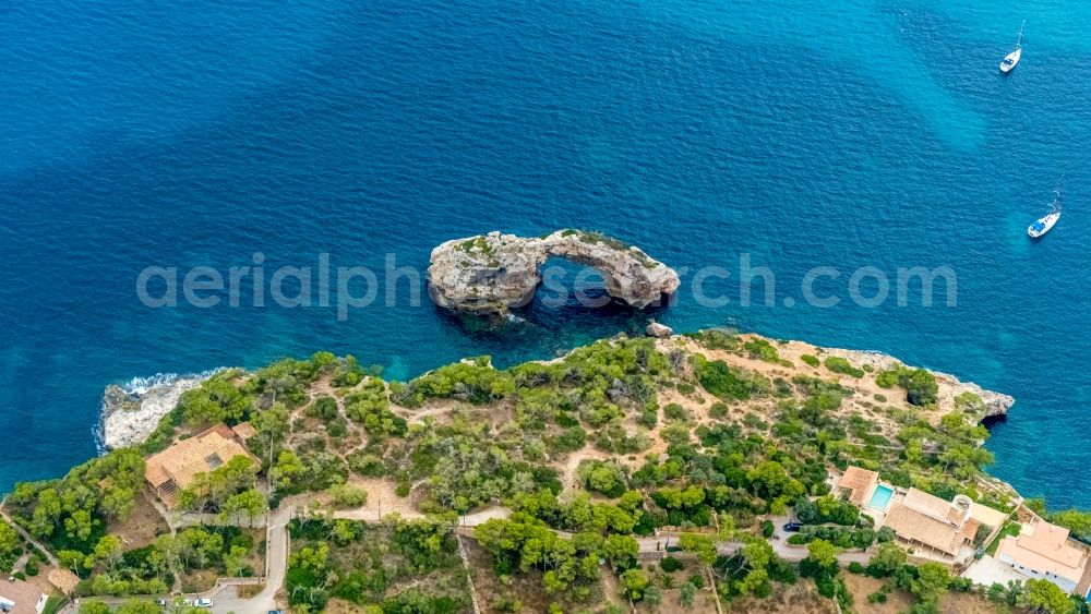 Santany from above - Rock Coastline on the cliffs with the rock formation Mirador des Pontas on the Balearic Sea in Santany in Islas Baleares, Spain