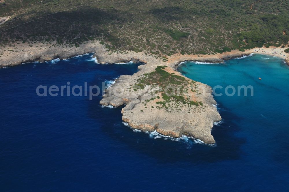 Punta de LLevant from the bird's eye view: Rock Coastline peninsula on the cliffs Punta de LLevant at Cala Varques in Mallorca in Balearic Islands, Spain