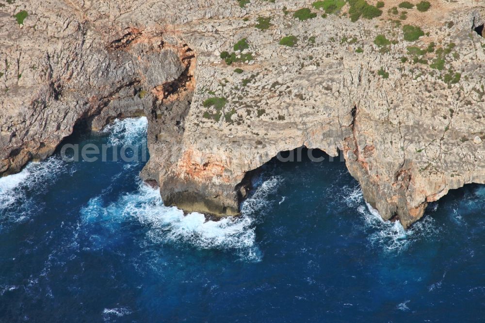 Manacor from the bird's eye view: Rock Coastline on the cliffs with caves at Cales de Mallorca in Manacor in Balearic Islands, Spain