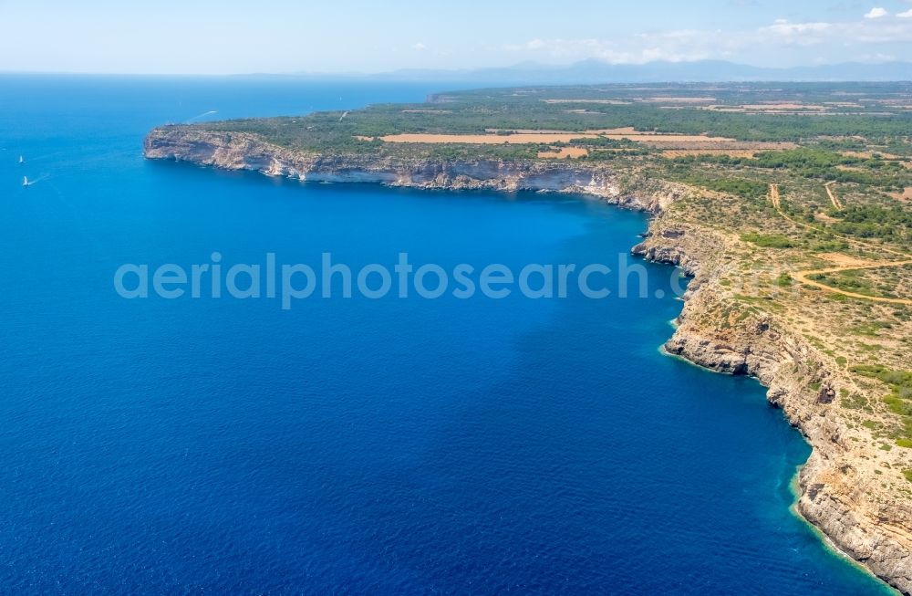 Llucmajor from the bird's eye view: Rock Coastline on the cliffs Far de Cap Blanc in Llucmajor in Balearische Insel Mallorca, Spain