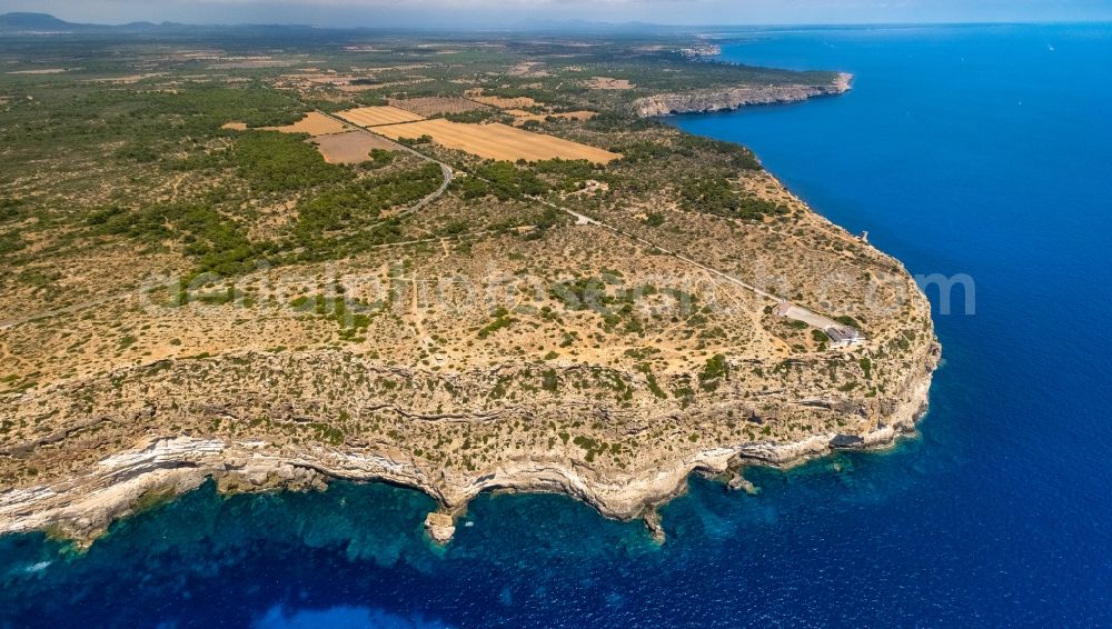 Aerial image Llucmajor - Rock Coastline on the cliffs Far de Cap Blanc in Llucmajor in Balearische Insel Mallorca, Spain