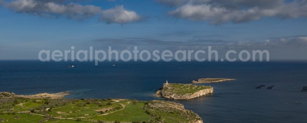 Aerial image Mellieha - Rock Coastline on the cliffs the island with the statue of Saint Paul in Mellieha in Il-Mistra, Malta