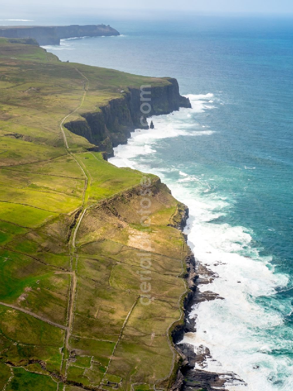 Cliffs of Moher from the bird's eye view: Rock Coastline on the cliffs North Atlantic Ocean in Cliffs of Moher in Clare, Ireland