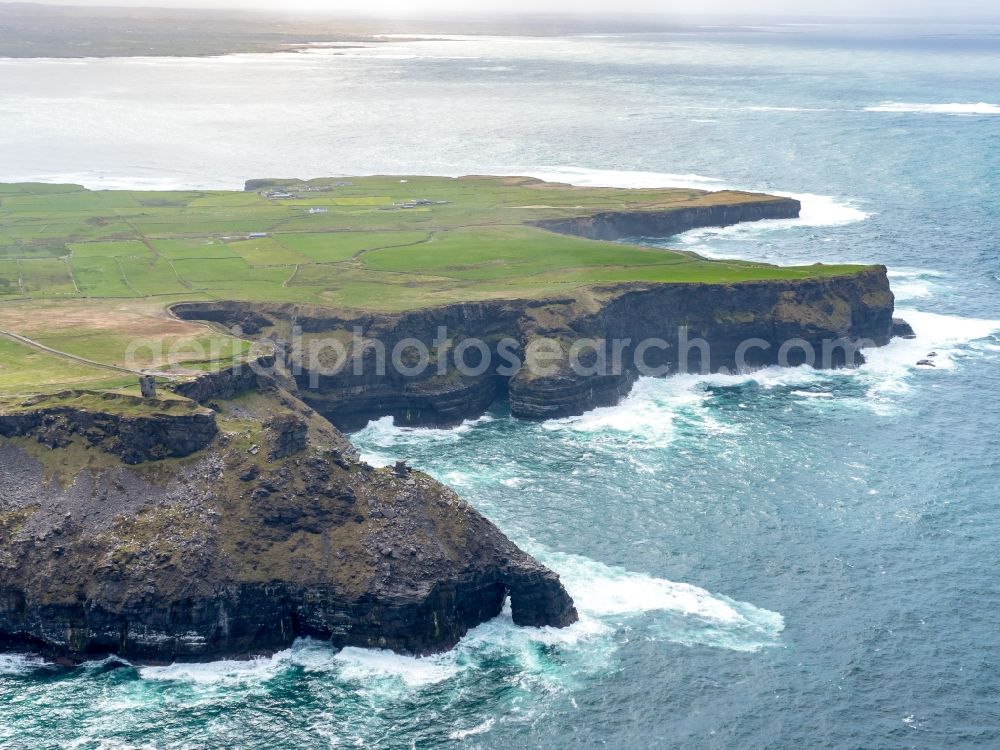 Aerial image Raha - Rock Coastline on the cliffs North Atlantic Ocean in Cliffs of Moher in Clare, Ireland