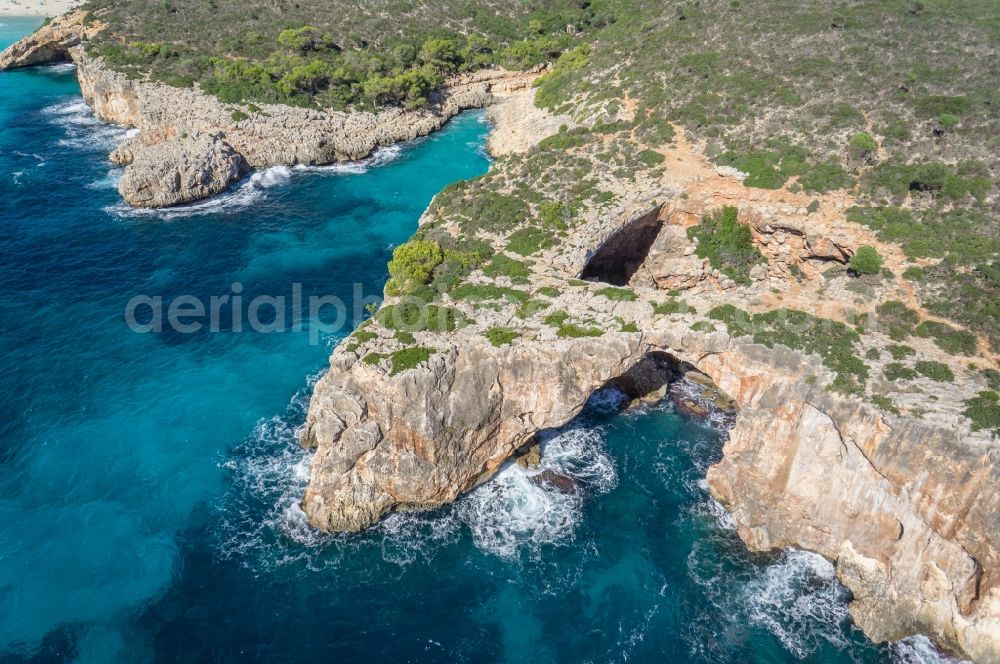 Aerial image Manacor - Landscape with rocks cliffs of Manacor on the Mediterranean coast of the Spanish Balearic island of Mallorca in Spain