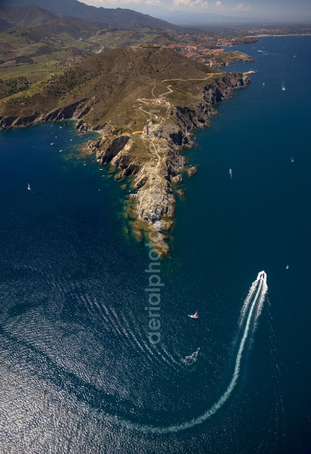 Aerial image Port-Vendres - Crags Bear Cap with lighthouse on the Mediterranean coast in Port-Vendres in the province of Languedoc-Roussillon in France