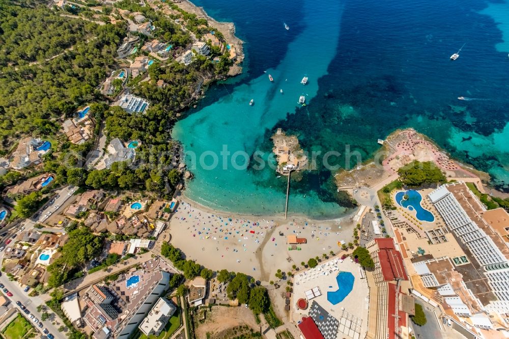 Aerial photograph Andratx - Plateau in the water of the small island with the Illeta restaurant with a jetty - connection to the Platja de Camp in Andratx in Balearic island of Mallorca, Spain