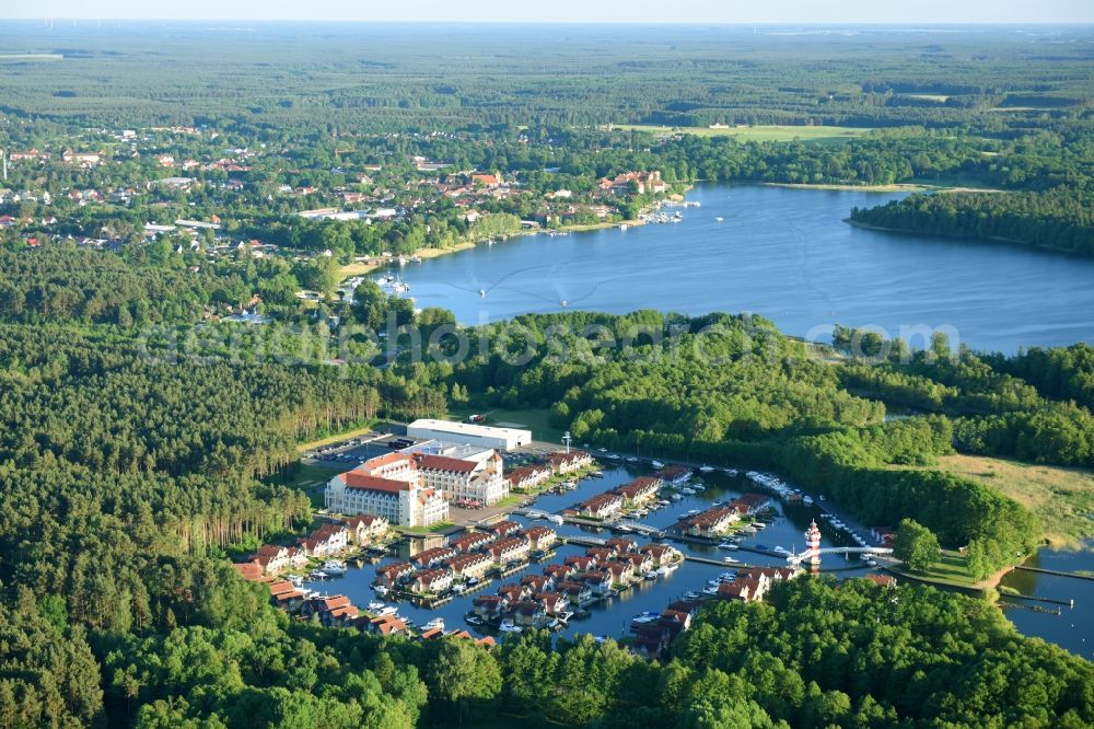 Aerial photograph Rheinsberg - Summer cottage arrangement Summer cottage harbour village of Marinapark Rheinsberg in Rheinsberg in the federal state Brandenburg. The arrangement is pursued by the Roompot Vakanties, the Netherlands