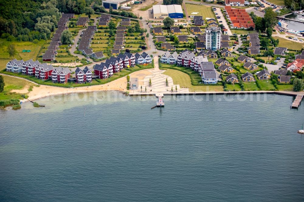 Rechlin from the bird's eye view: Holiday houses of the park Hafendorf Mueritz with Lake Claassee and its marina in Rechlin in the state of Mecklenburg - Western Pomerania