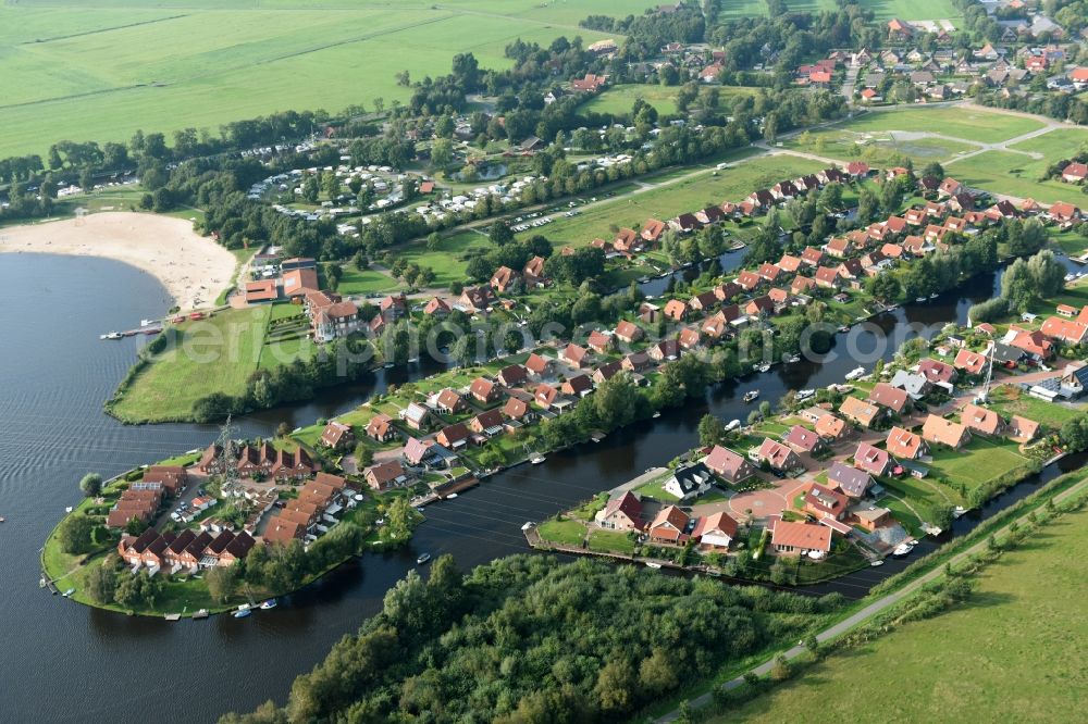 Aerial photograph Großefehn - Holiday house plant of the park at the lake timmeler sea with a bathing beach and meadows in Grossefehn in the state Lower Saxony