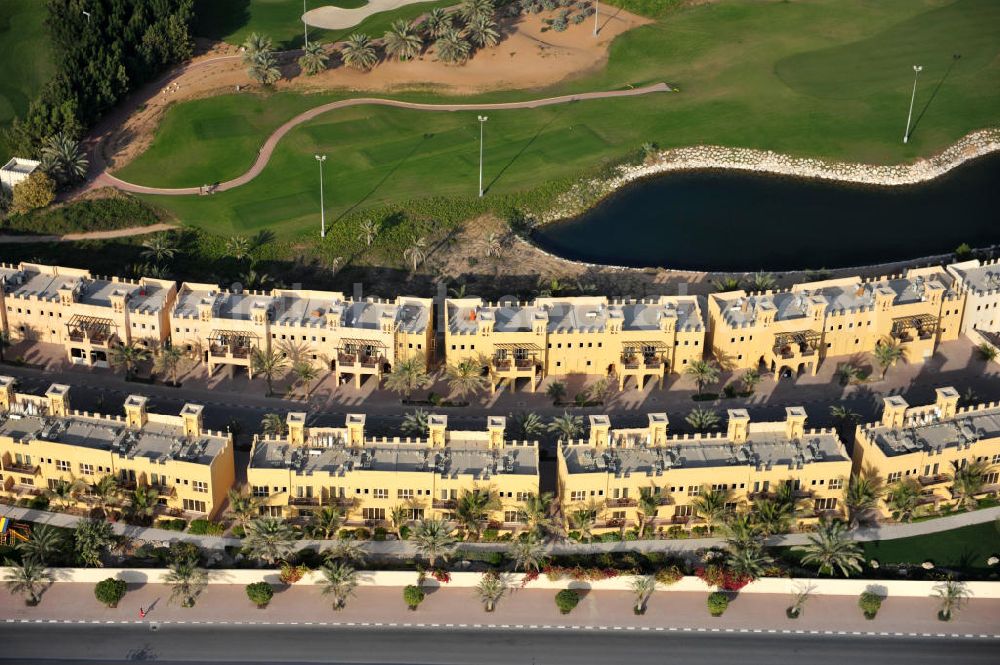 Aerial image Ras Al Khaimah - Settlement of leisure residences near the Al Hamra Golf Club in the arab emirate Ras Al Khaimah. The leisure residences are part of the Al Hamra Village Project, the second largest construction project of Ras Al Khaimah. The project is realized by the state-owned company Al Hamra Real Estate