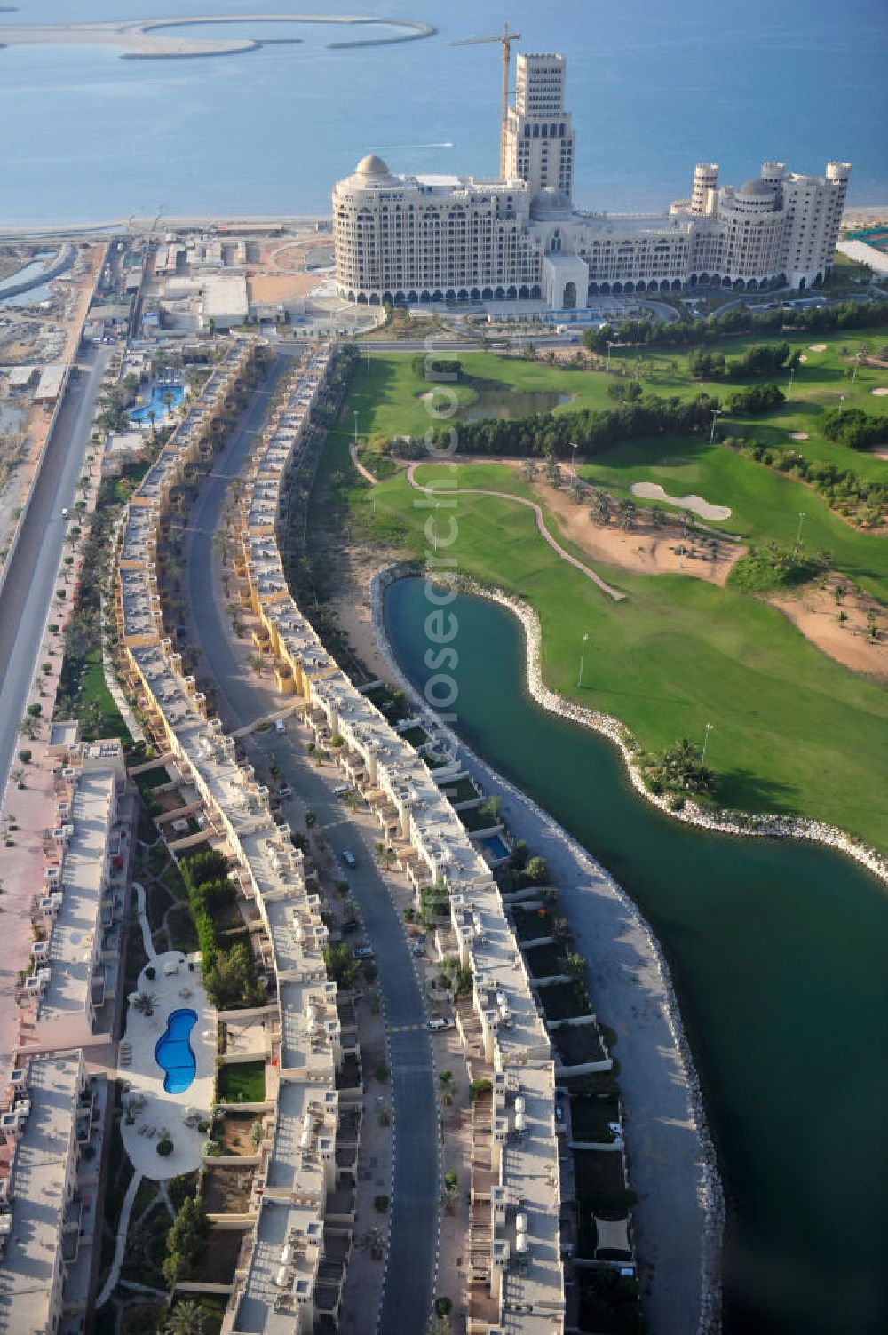 Ras Al Khaimah from above - Settlement of leisure residences near the Al Hamra Golf Club in the arab emirate Ras Al Khaimah. The leisure residences are part of the Al Hamra Village Project, the second largest construction project of Ras Al Khaimah. The project is realized by the state-owned company Al Hamra Real Estate