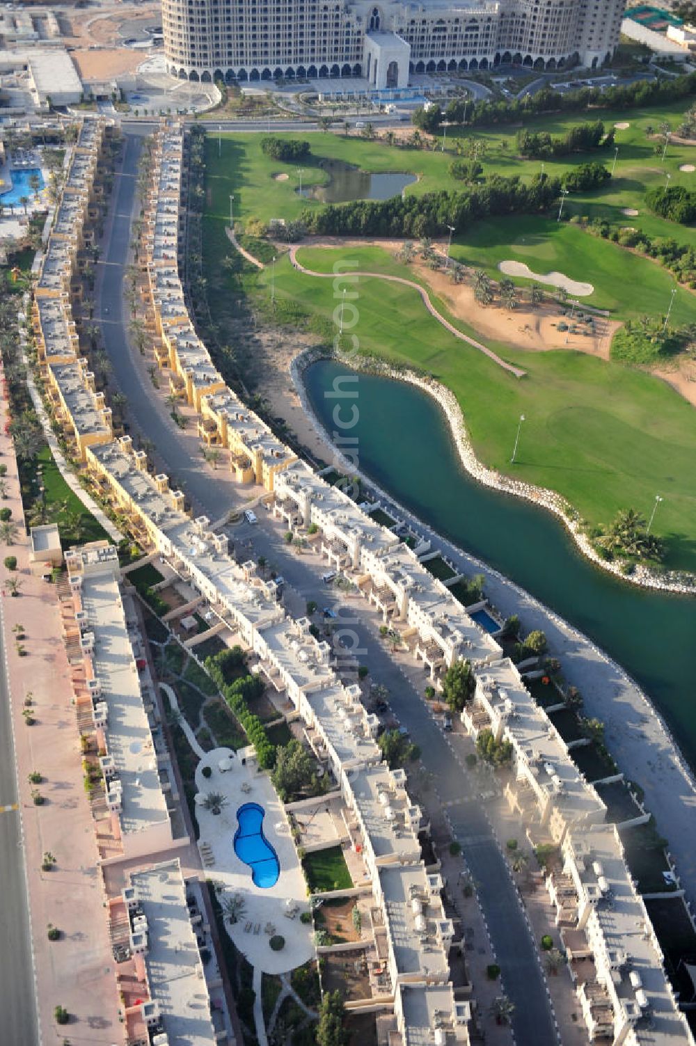 Ras Al Khaimah from the bird's eye view: Settlement of leisure residences near the Al Hamra Golf Club in the arab emirate Ras Al Khaimah. The leisure residences are part of the Al Hamra Village Project, the second largest construction project of Ras Al Khaimah. The project is realized by the state-owned company Al Hamra Real Estate