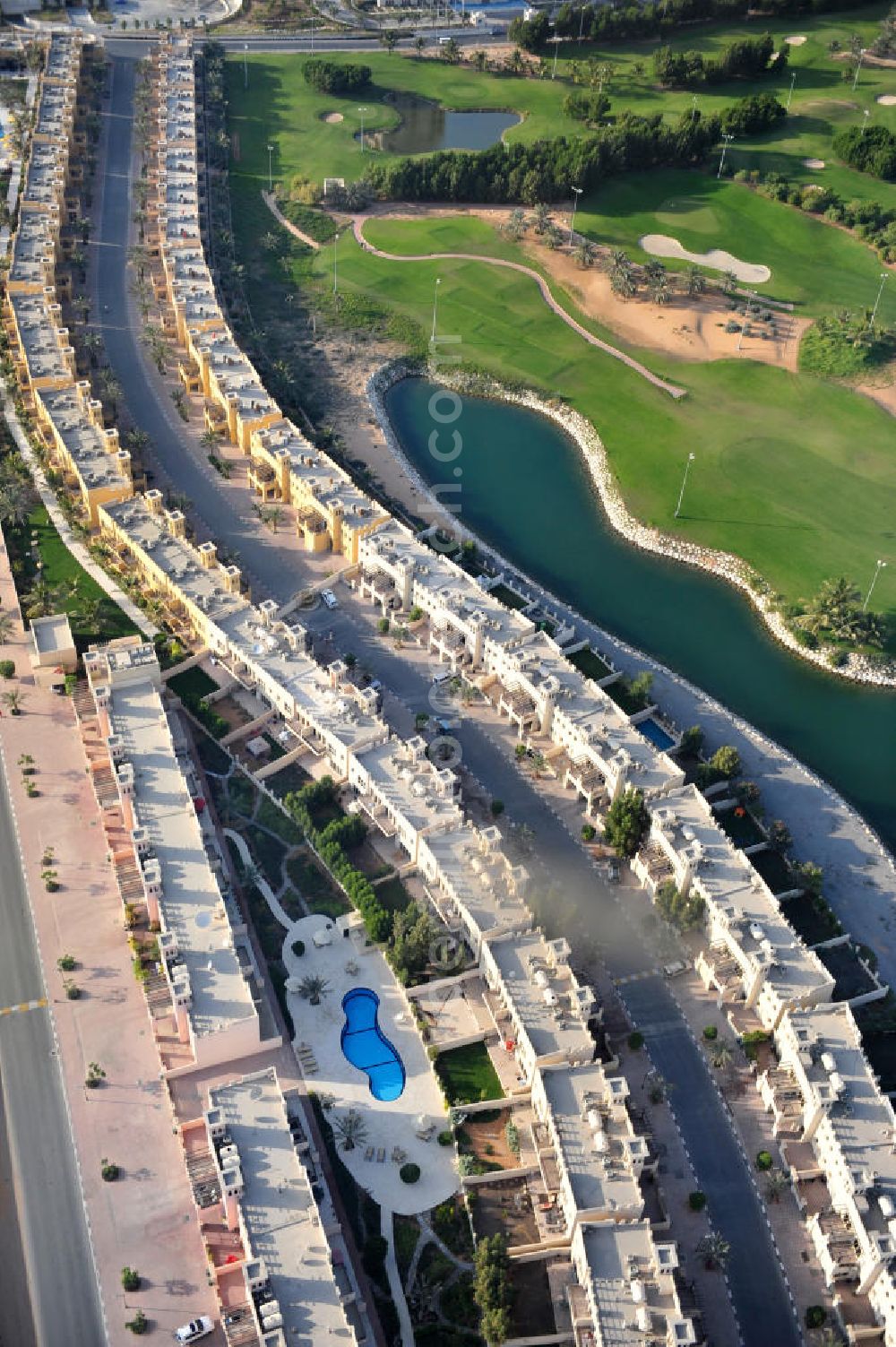 Aerial image Ras Al Khaimah - Settlement of leisure residences near the Al Hamra Golf Club in the arab emirate Ras Al Khaimah. The leisure residences are part of the Al Hamra Village Project, the second largest construction project of Ras Al Khaimah. The project is realized by the state-owned company Al Hamra Real Estate