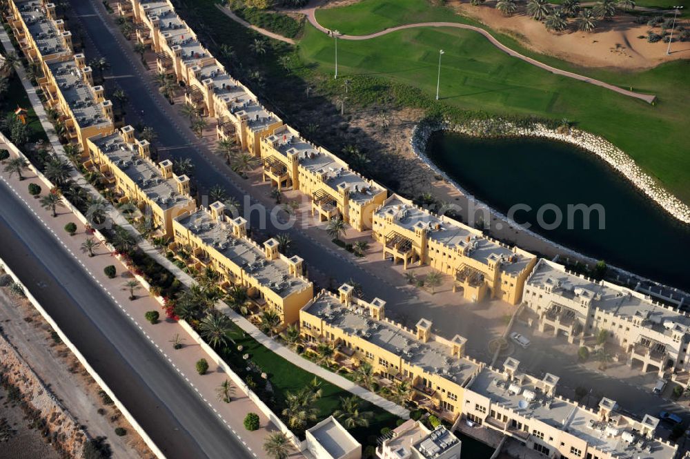 Aerial photograph Ras Al Khaimah - Settlement of leisure residences near the Al Hamra Golf Club in the arab emirate Ras Al Khaimah. The leisure residences are part of the Al Hamra Village Project, the second largest construction project of Ras Al Khaimah. The project is realized by the state-owned company Al Hamra Real Estate