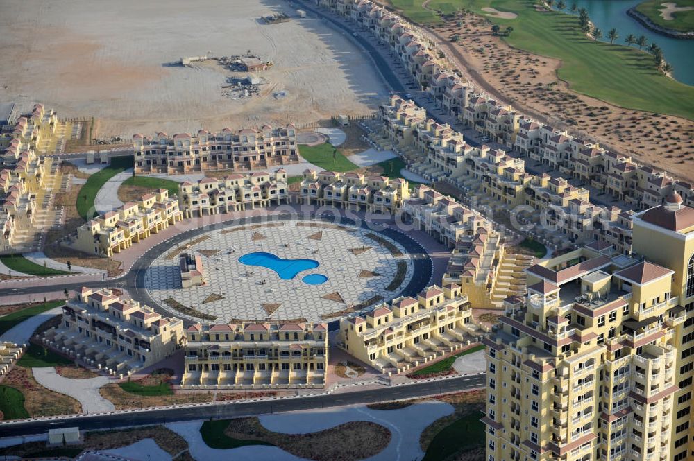 Ras Al Khaimah from above - Settlement of Town House Type C leisure residences in the arab emirate Ras Al Khaimah. The leisure residences are part of the Al Hamra Village Project, the second largest construction project of Ras Al Khaimah. The project is realized by the state-owned company Al Hamra Real Estate