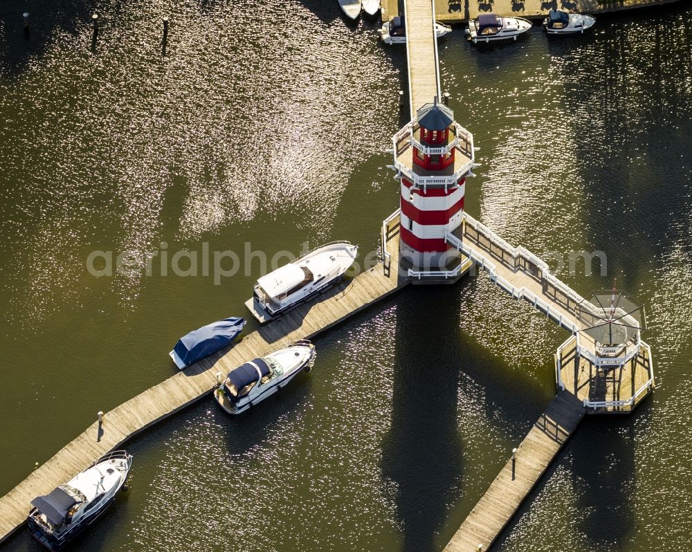 Rheinsberg from the bird's eye view: Holiday homes / vacation houses in the harbour / harbor village at the street Kaistrasse at the lake Rheinsberger See near the town Rheinsberg in Brandenburg