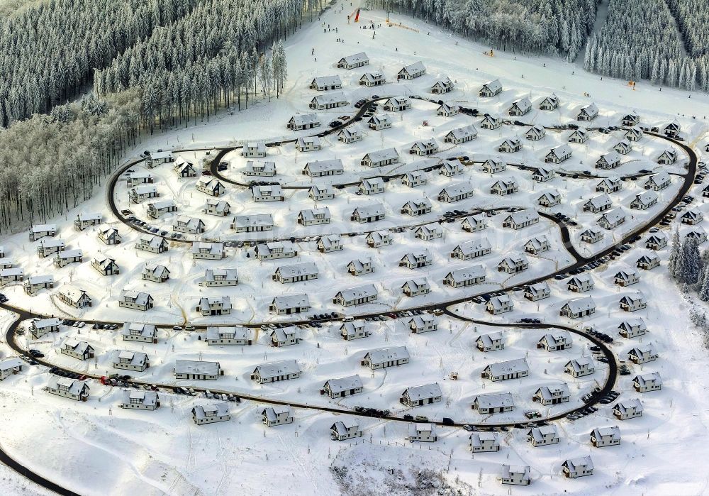 Winterberg from the bird's eye view: View of the partially snow covered foggy and cloudy landscape of the Landal Holiday park in the state North Rhine-Westphalia