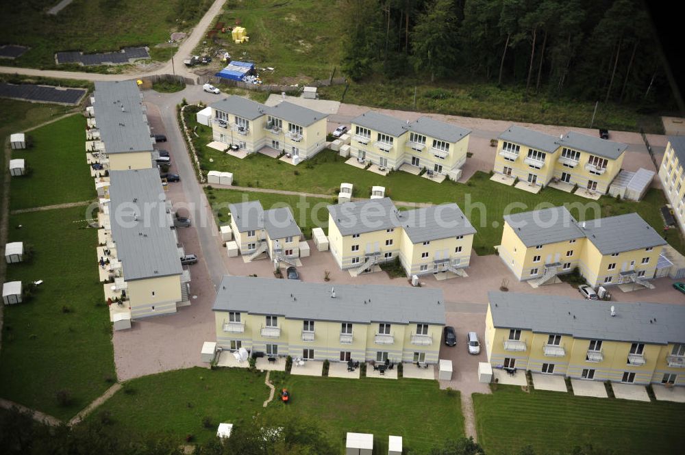 Graal-Müritz from the bird's eye view: Blick auf den Ferienwohnpark im Küstenwald der HAWO Bauträger KG in unmittelbarer Strandnähe im Ostseeheilbad Graal-Müritz. Aus einer ehemaligen NVA Liegenschaft entstanden attraktive Ferienhäuser und Ferienwohneinheiten zum Verkauf und zur Vermietung. View of the coastal forest of the housing estate developers HAWO KG near the beach in the spa town of Graal Müritz.