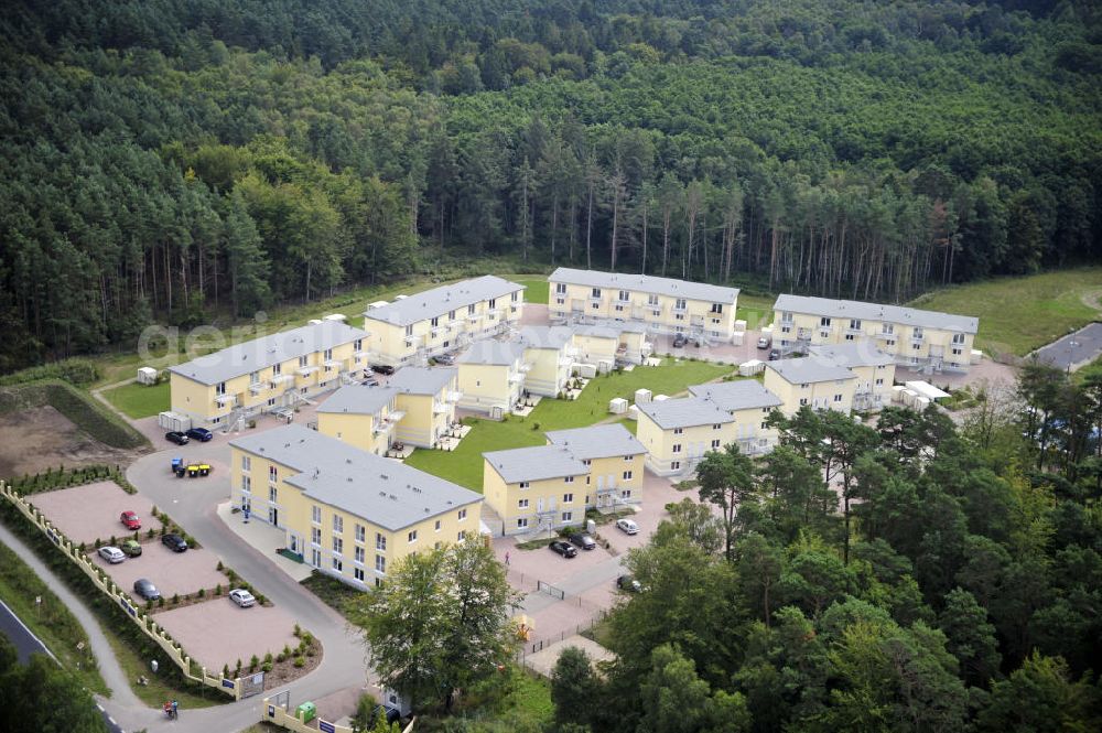 Graal-Müritz from above - Blick auf den Ferienwohnpark im Küstenwald der HAWO Bauträger KG in unmittelbarer Strandnähe im Ostseeheilbad Graal-Müritz. Aus einer ehemaligen NVA Liegenschaft entstanden attraktive Ferienhäuser und Ferienwohneinheiten zum Verkauf und zur Vermietung. View of the coastal forest of the housing estate developers HAWO KG near the beach in the spa town of Graal Müritz.